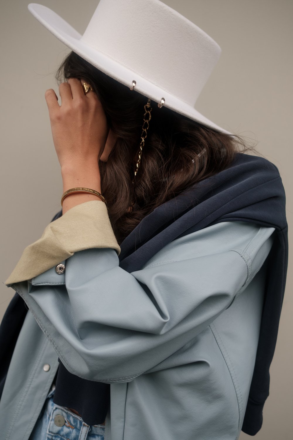 Fashionable Woman in White Hat Close-up